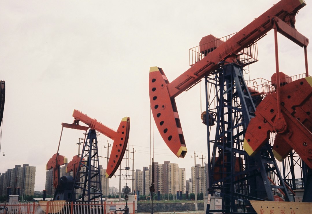 Home a-group-of-oil-pumps-sitting-next-to-each-other-gqggyfhjkza
